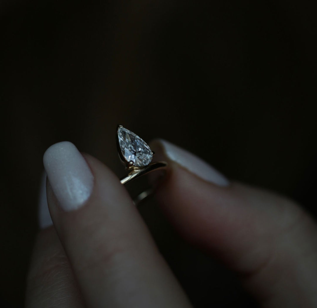 Angled view of pear cut diamond in solitaire setting