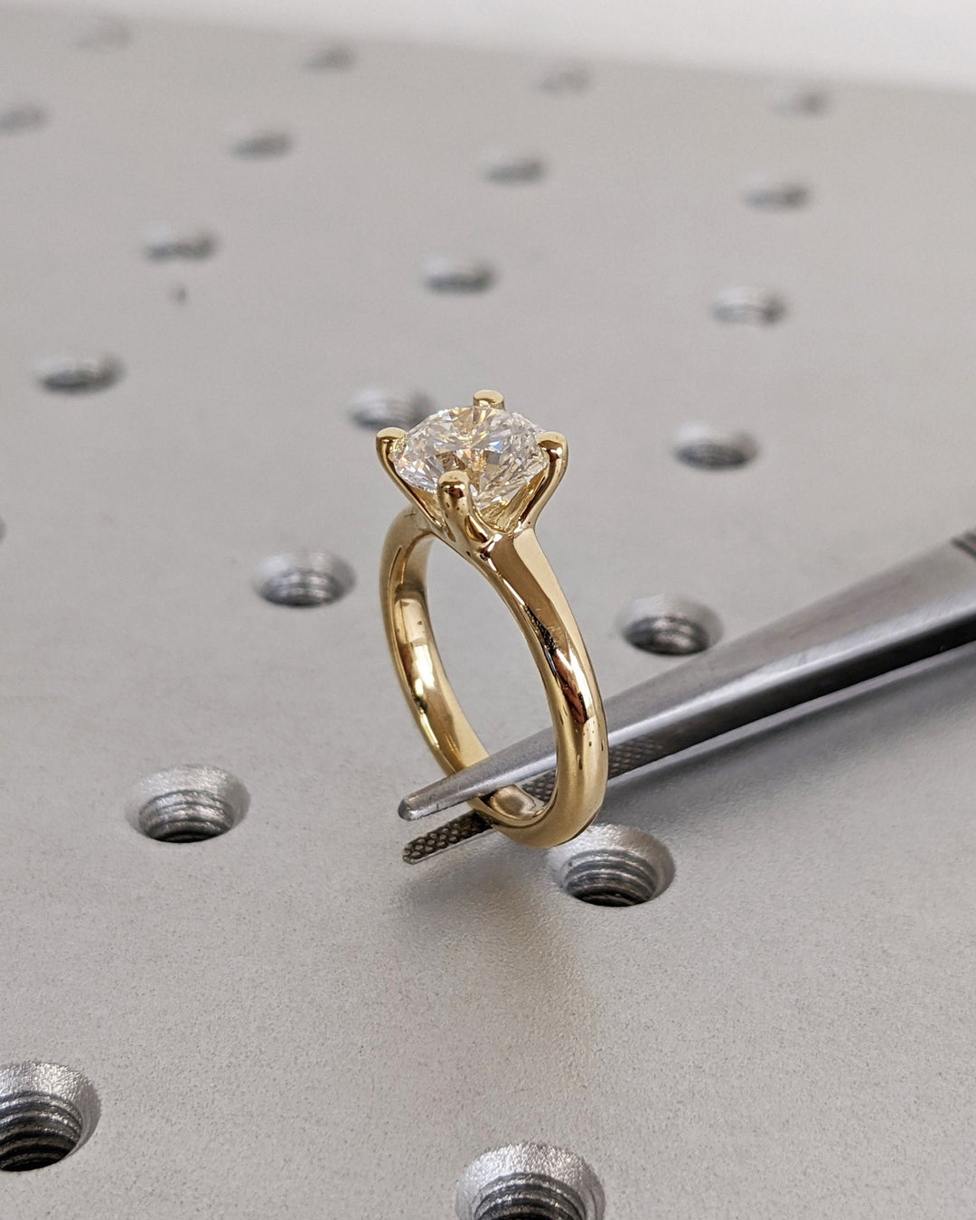 Round solitaire lab grown diamond ring side profile in gold setting