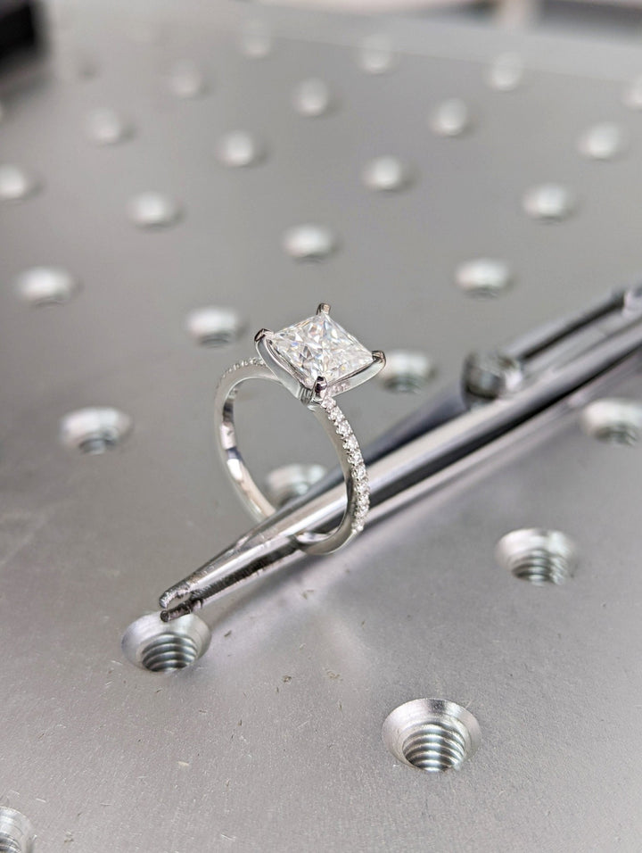 Profile view of princess cut pave engagement ring band