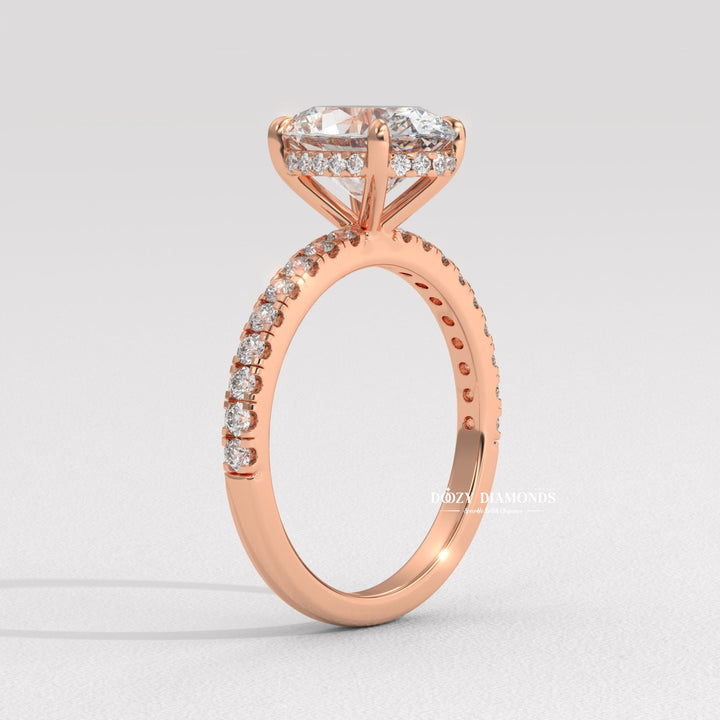 Oval hidden halo engagement ring shown on hand for true-to-life sizing