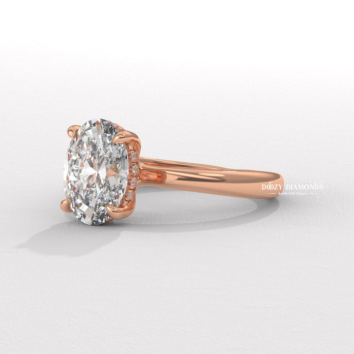 Oval solitaire lab grown diamond ring fitted on finger