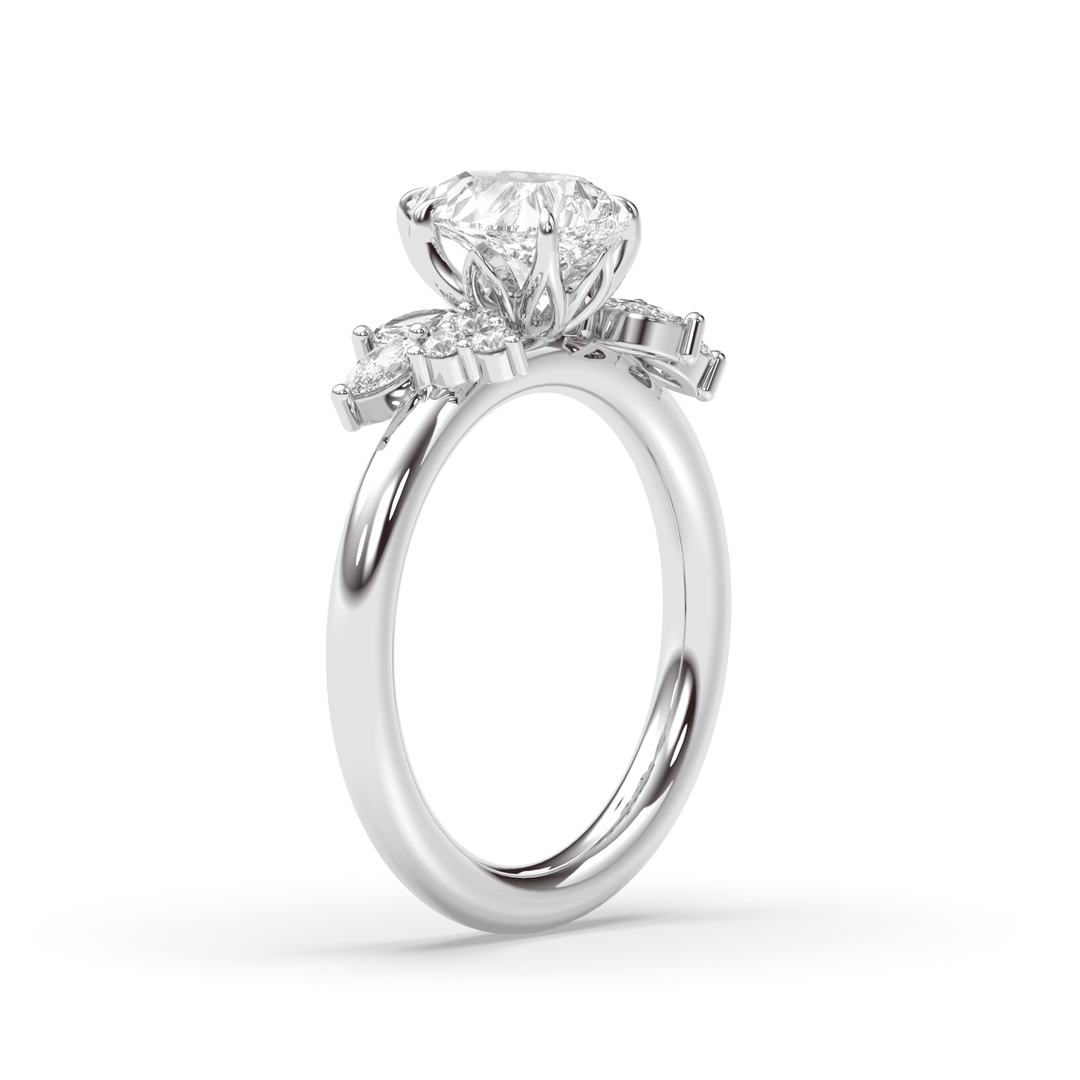 Pear cluster engagement ring finished in polished solid gold
