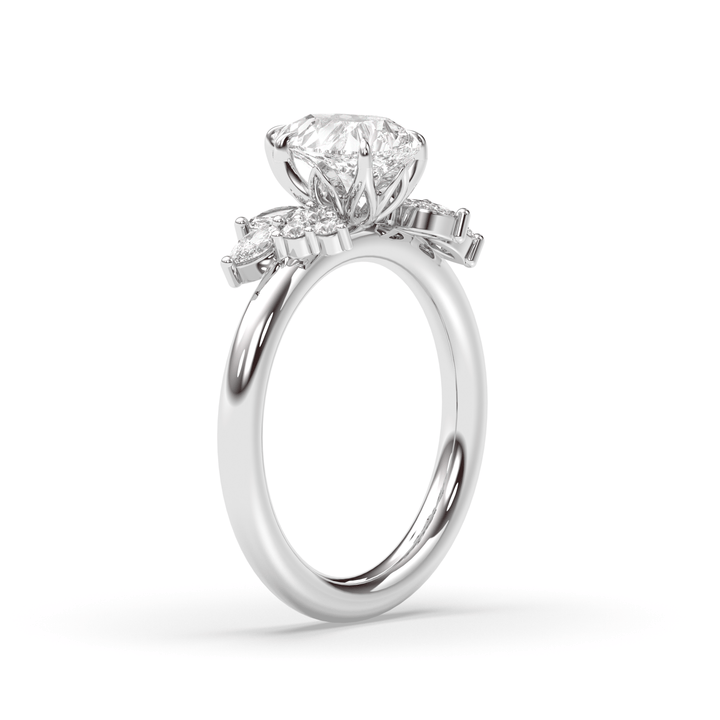 Pear cluster engagement ring finished in polished solid gold