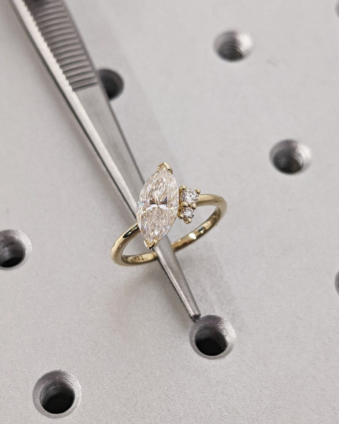 Marquise cut cluster engagement ring shown in real-life wear