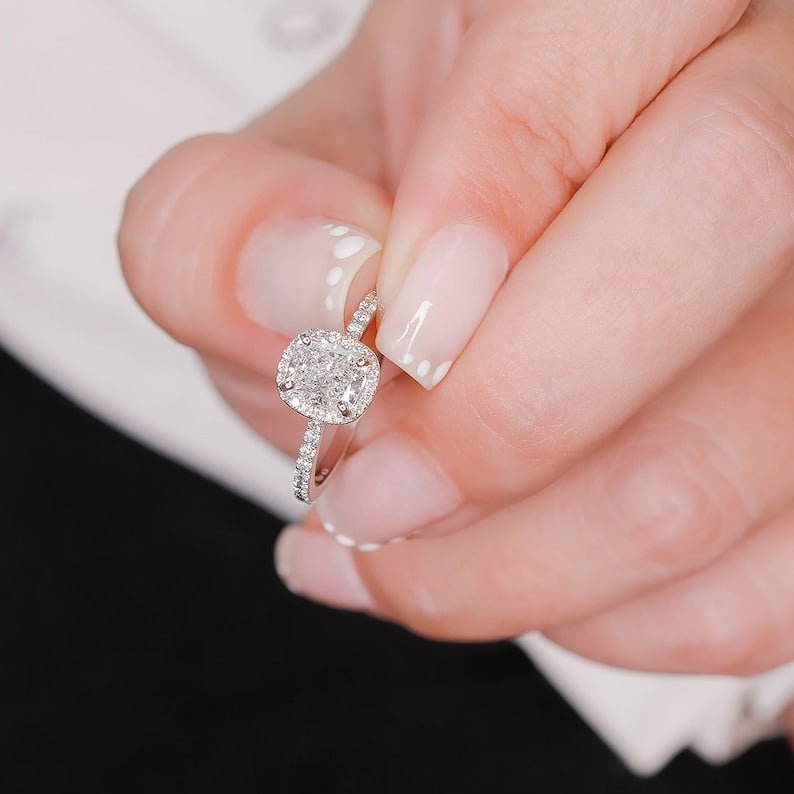 Side angle of cushion halo diamond engagement ring