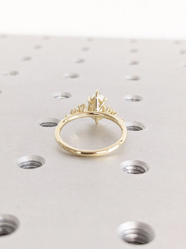 Handcrafted pear cut cluster lab grown diamond engagement ring