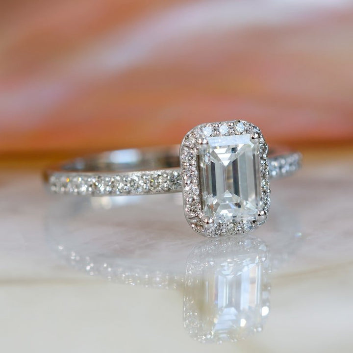 Emerald cut diamond ring worn on hand