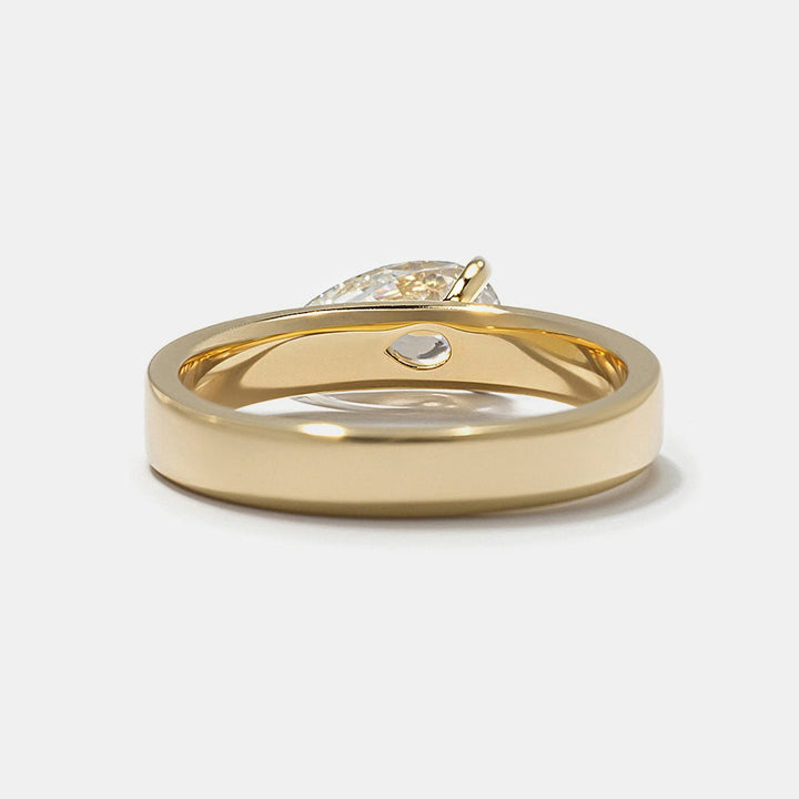 Side angle of pear east west diamond engagement ring