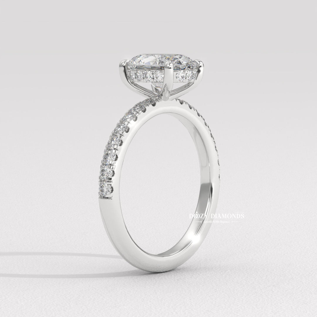 Side angle of oval hidden halo diamond engagement ring