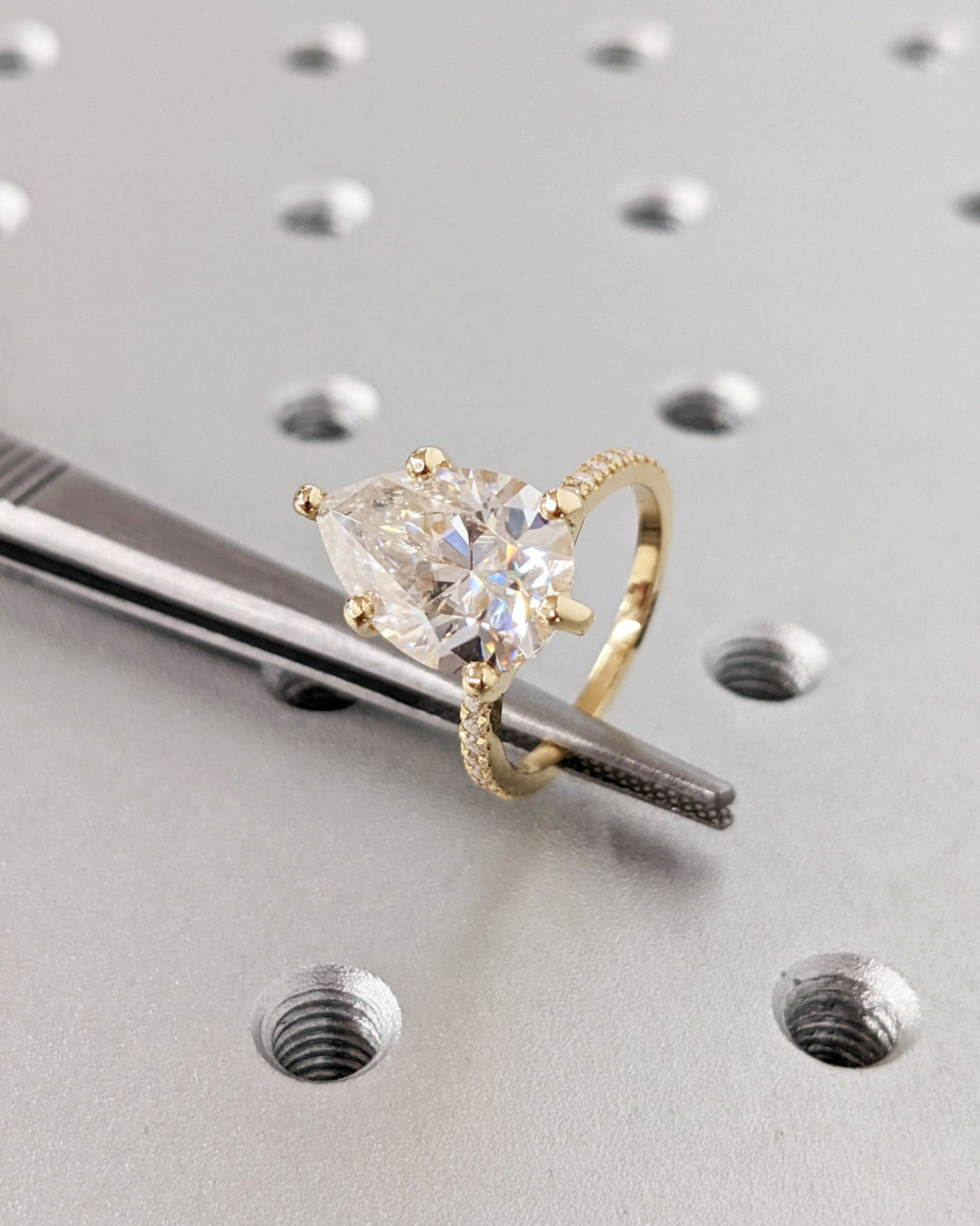 Fine craftsmanship detail on pear hidden halo engagement ring