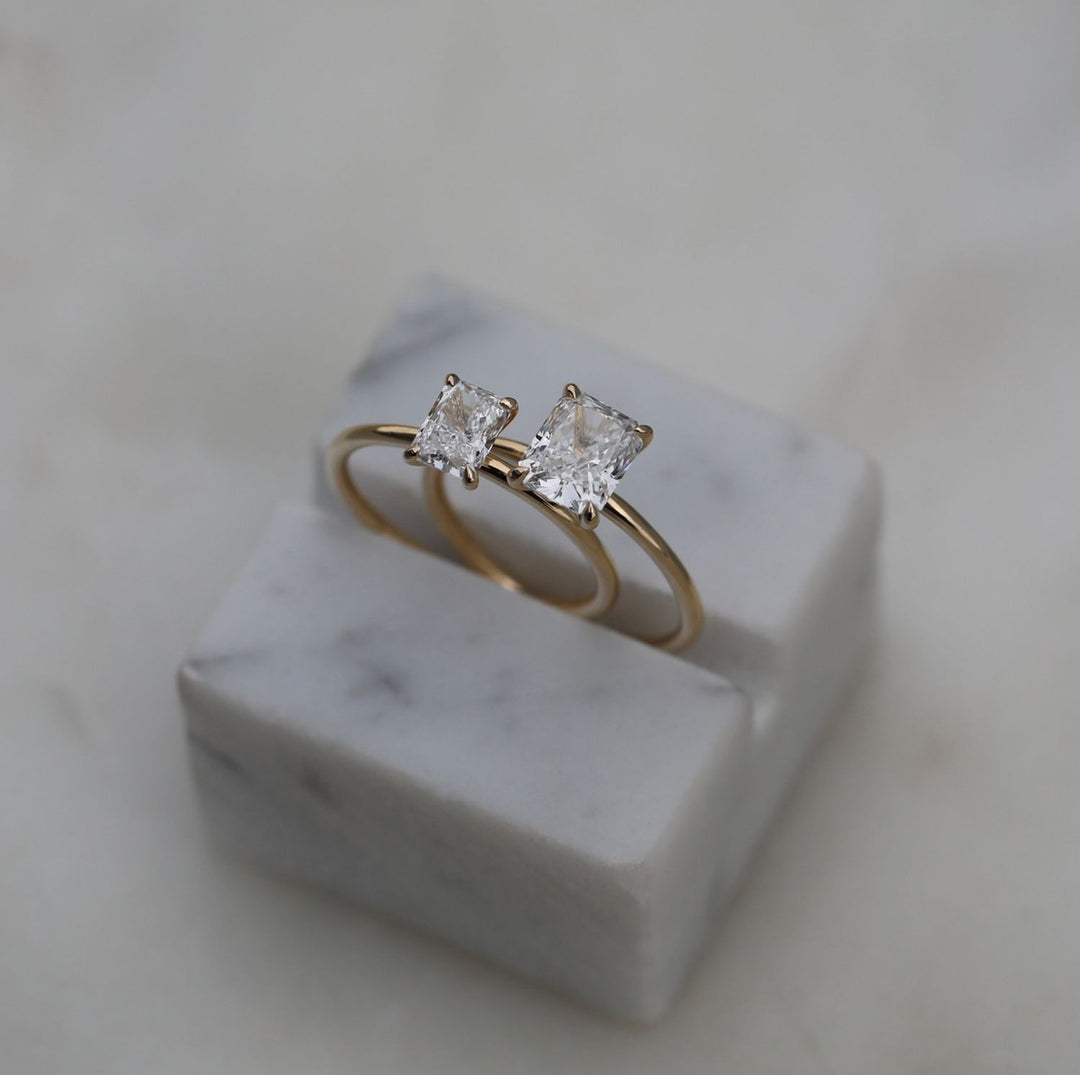 Radiant solitaire engagement ring viewed from the side