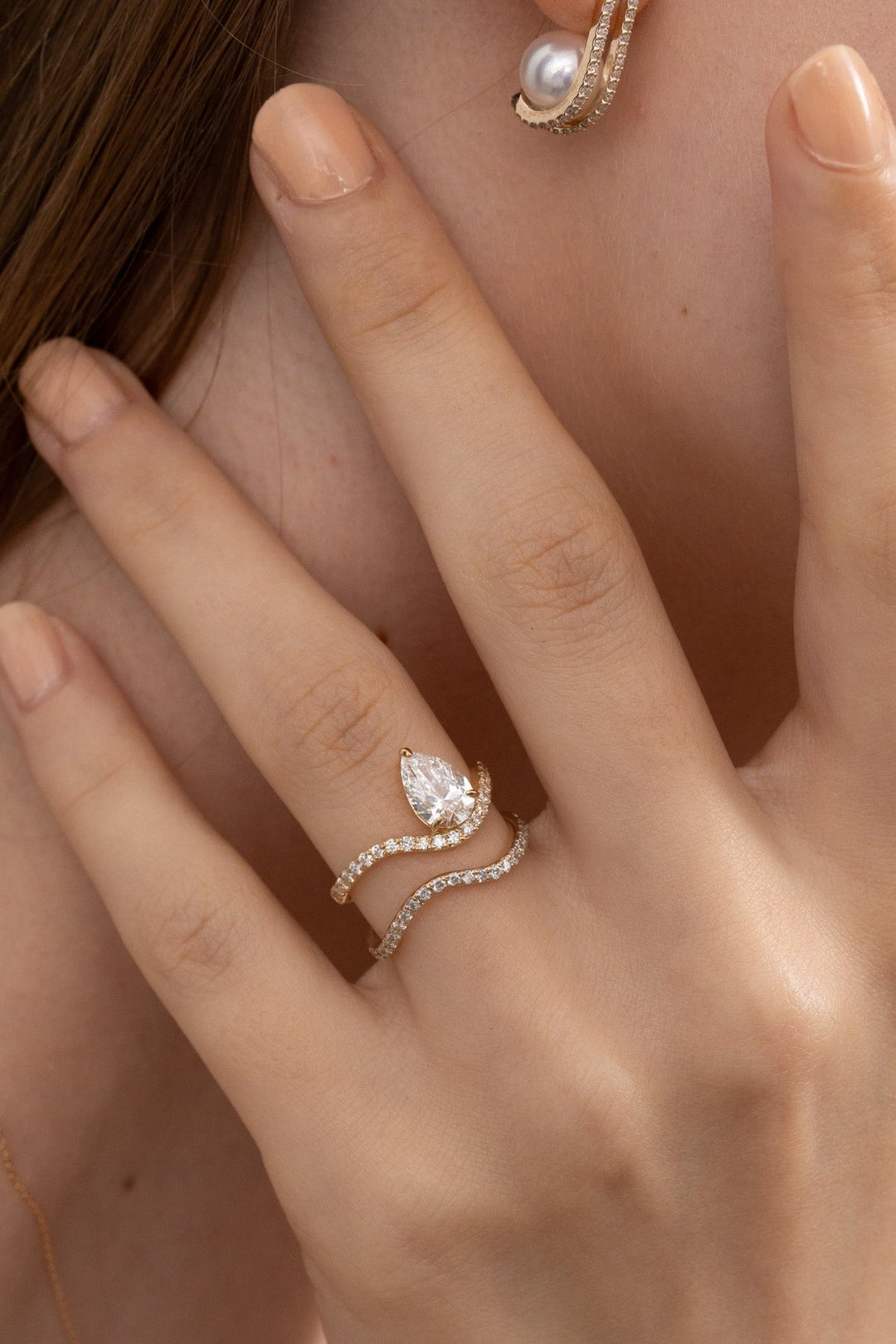 Detailed close-up of pear solitaire diamond engagement ring