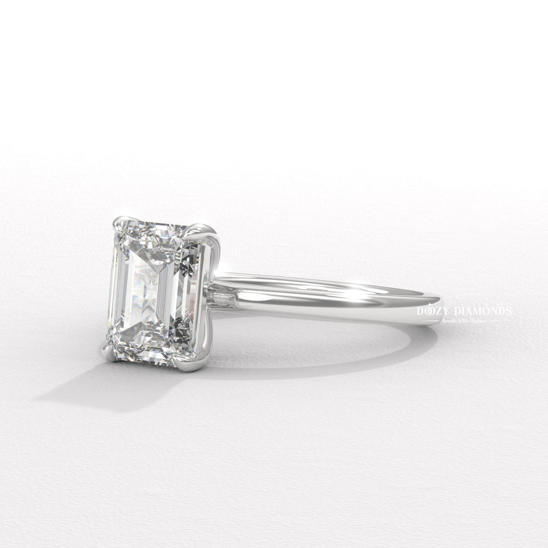 Angled view of emerald cut diamond in solitaire setting