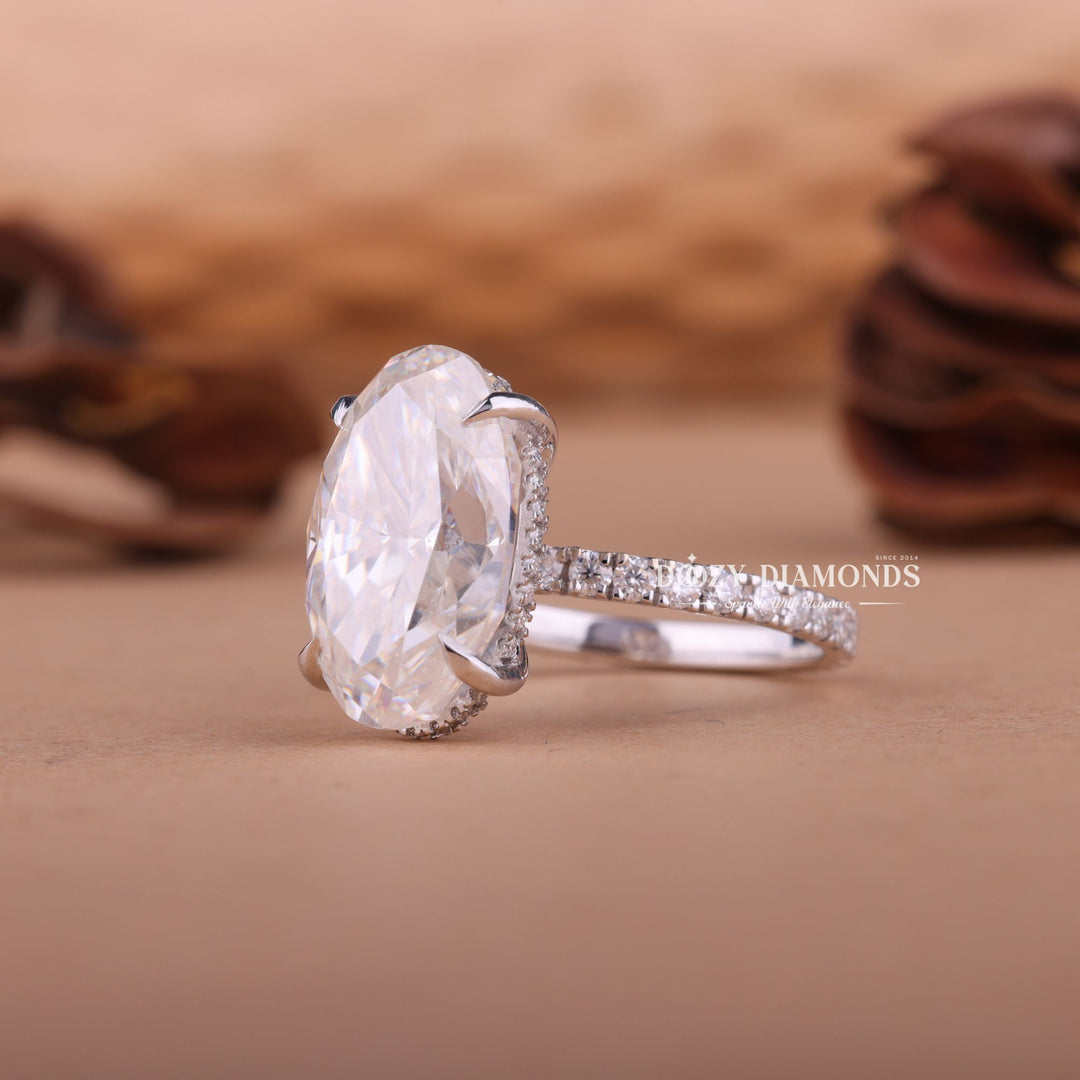 Certified oval cut diamond featured in hidden halo engagement ring