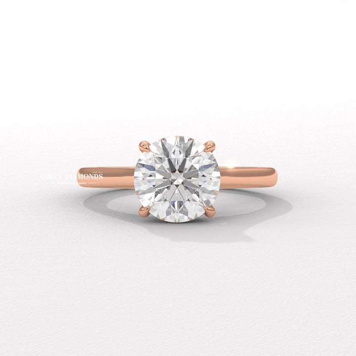 Side angle of round solitaire diamond engagement ring