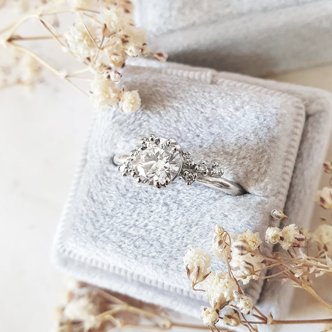 Round cluster engagement ring with IGI certificate and packaging