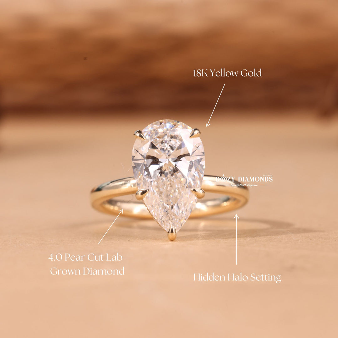 Pear hidden halo engagement ring close-up showing E/VS1 diamond clarity