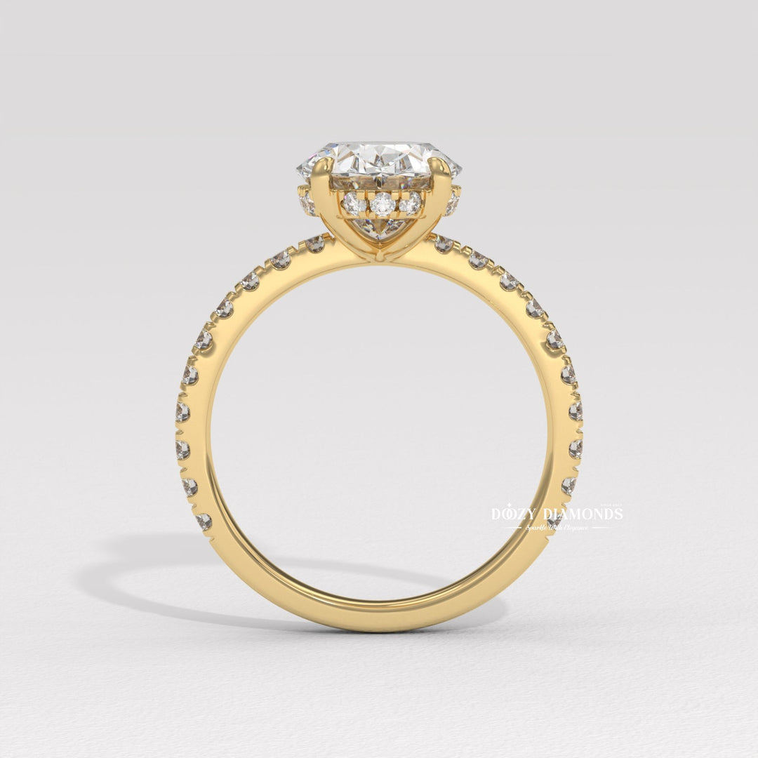 Detailed close-up of oval hidden halo diamond engagement ring