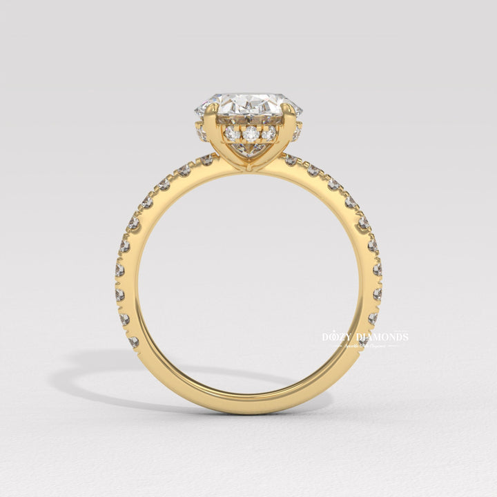 Detailed close-up of oval hidden halo diamond engagement ring