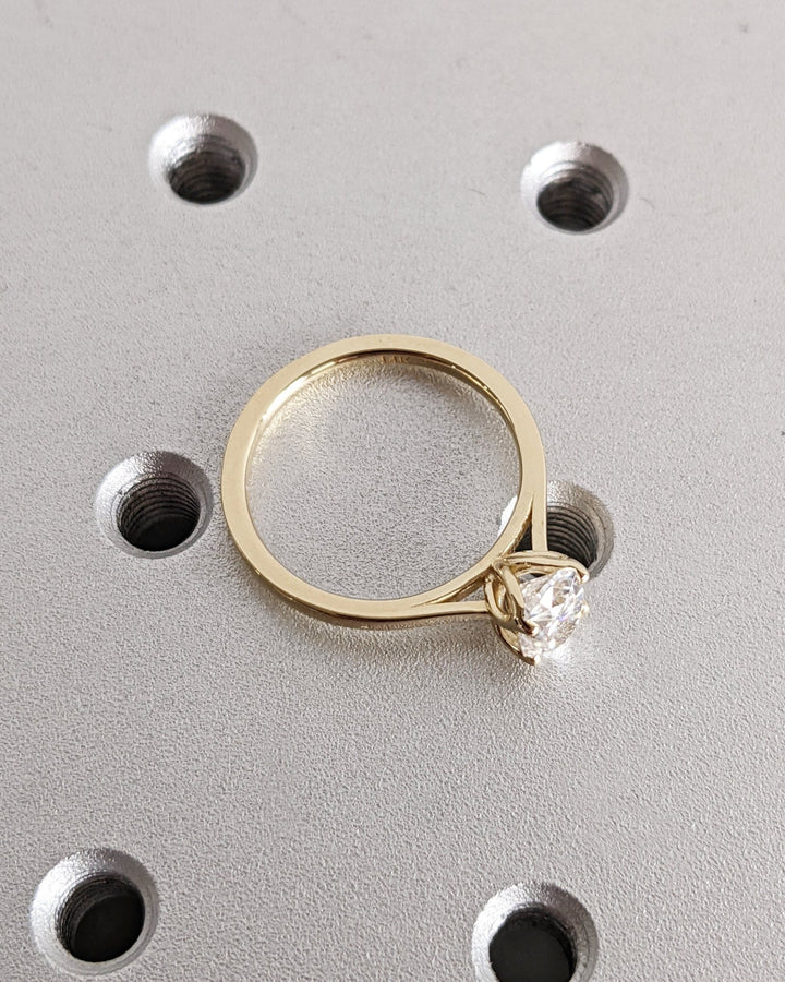 Close-up of oval cut center diamond in solitaire engagement ring