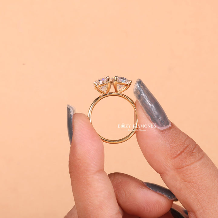 Oval solitaire diamond ring displayed on jewelry stand