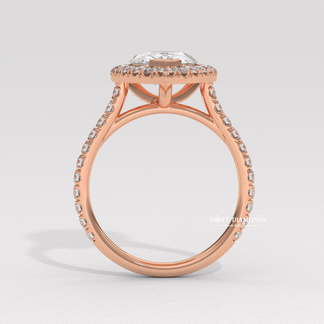 Detailed close-up of pear halo diamond engagement ring