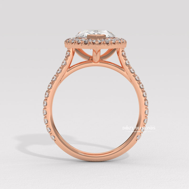 Detailed close-up of pear halo diamond engagement ring
