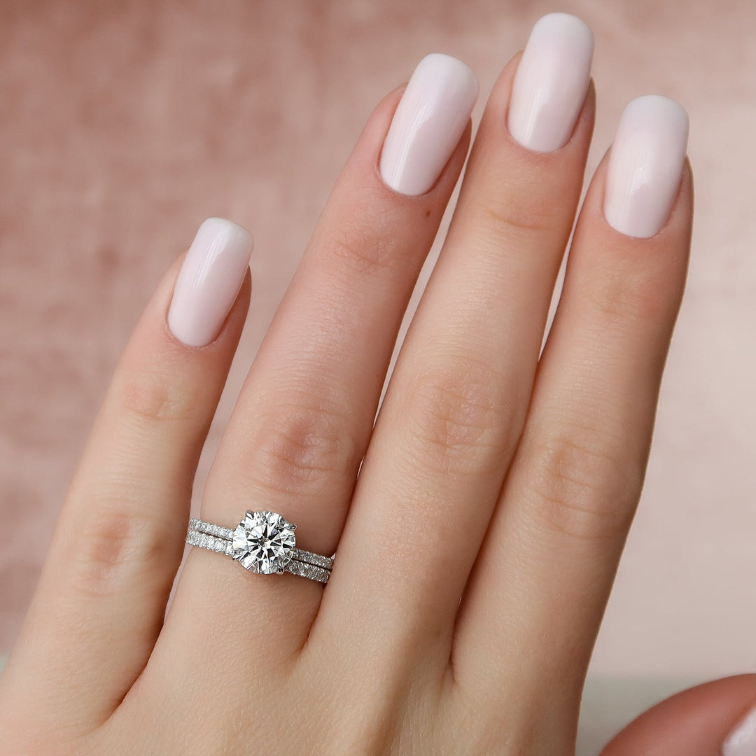 Round hidden halo engagement ring close-up highlighting diamond sparkle