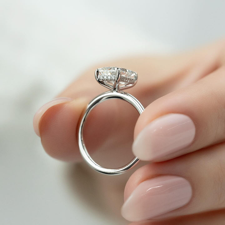 Radiant hidden halo diamond engagement ring available in multiple metals