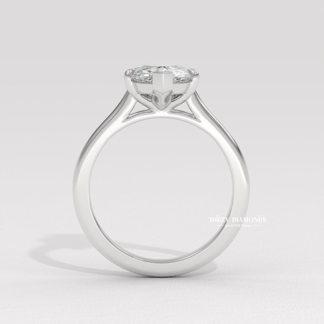 Macro shot of pear cut diamond facets in solitaire ring setting