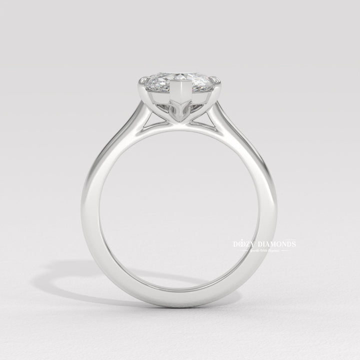 Macro shot of pear cut diamond facets in solitaire ring setting
