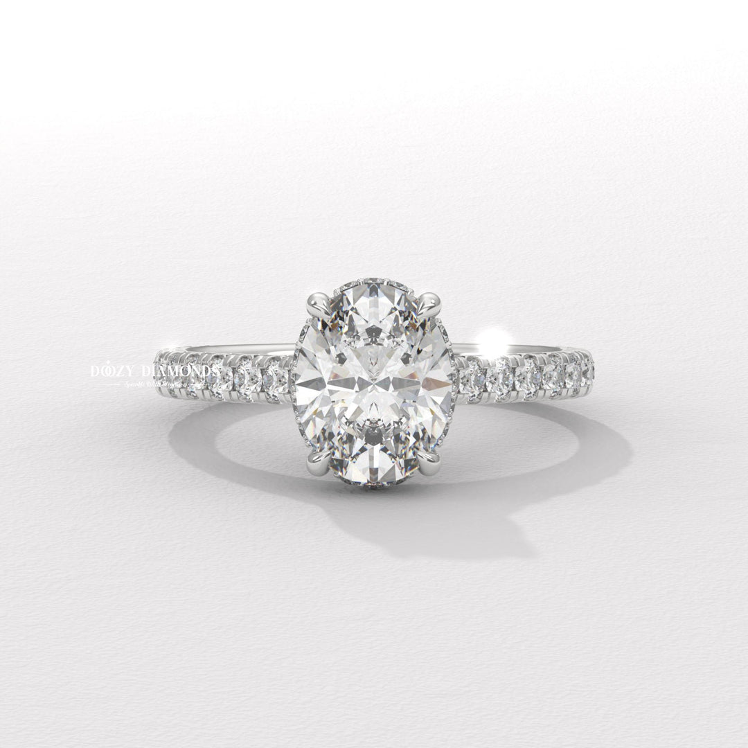 Macro shot of oval cut diamond facets in halo ring setting