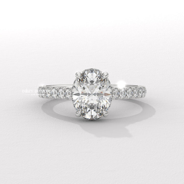 Macro shot of oval cut diamond facets in halo ring setting