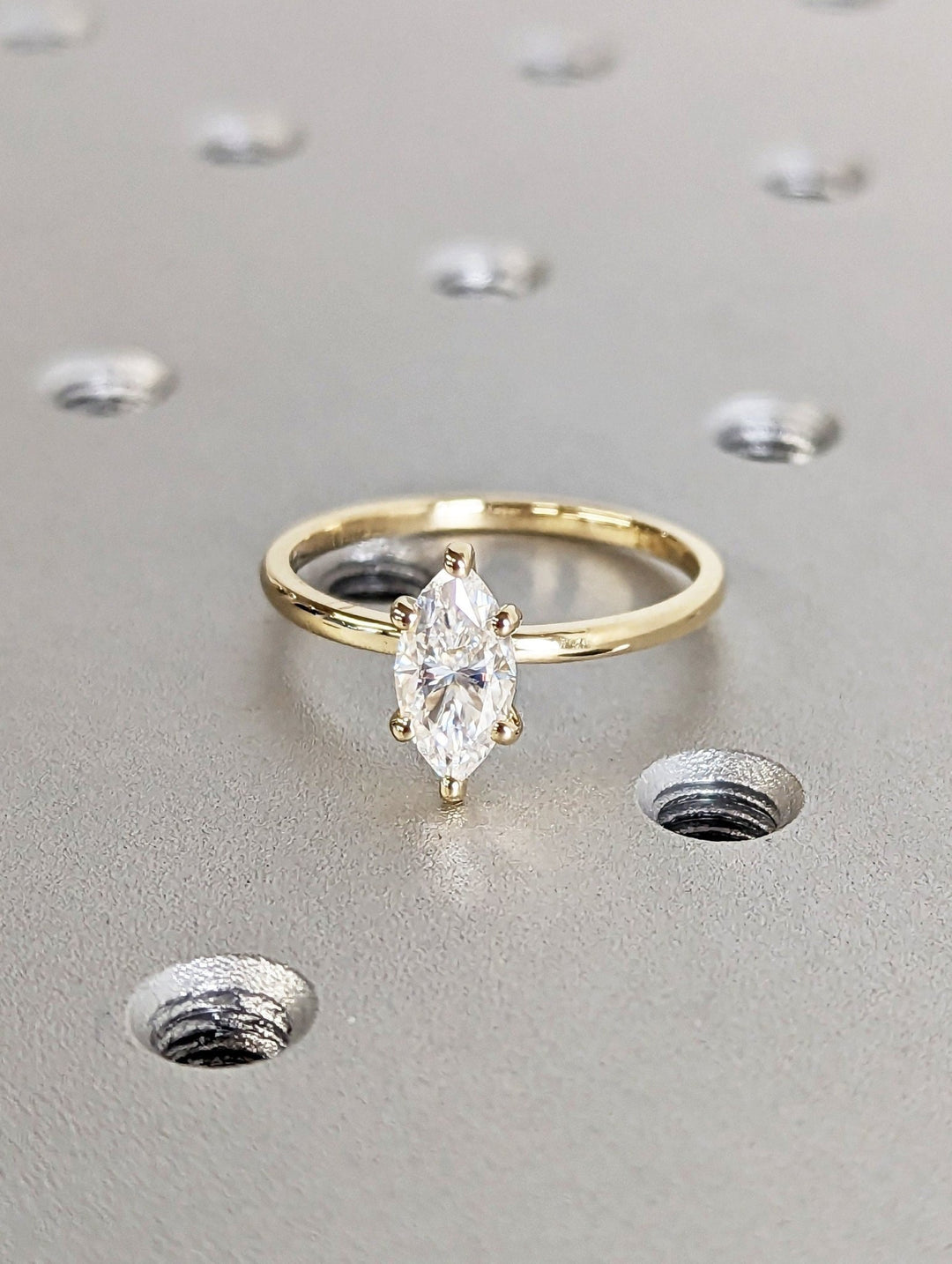Marquise solitaire engagement ring viewed from the side