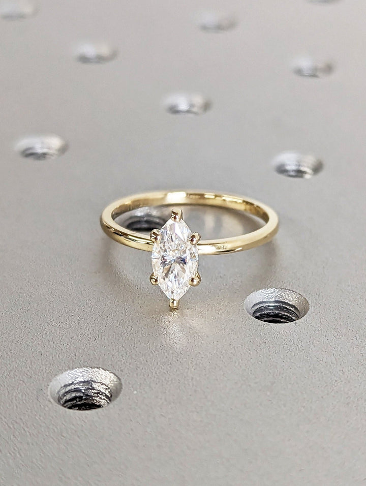 Marquise solitaire engagement ring viewed from the side