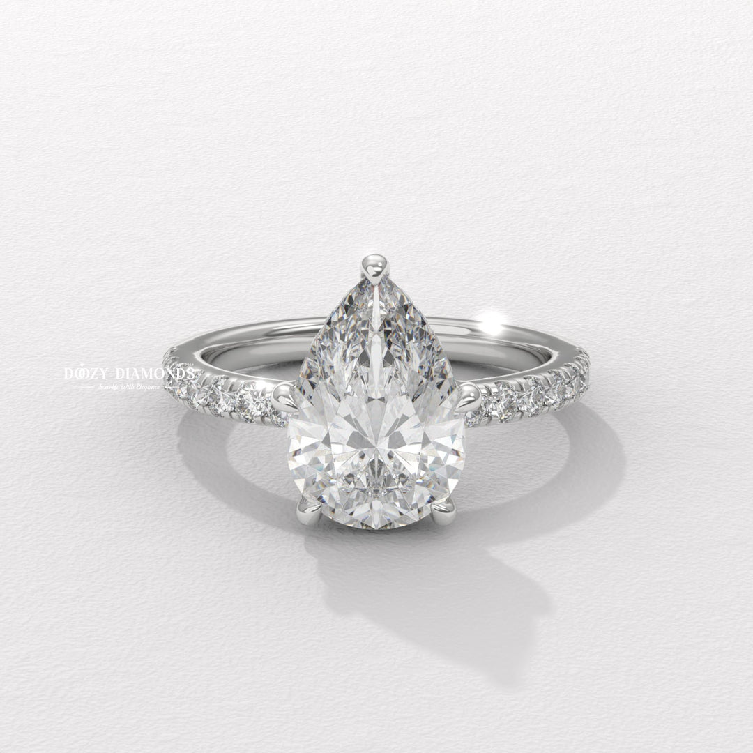 Macro shot of pear cut diamond facets in solitaire ring setting