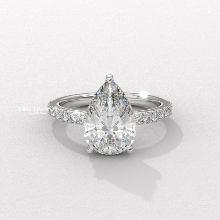 Macro shot of pear cut diamond facets in solitaire ring setting