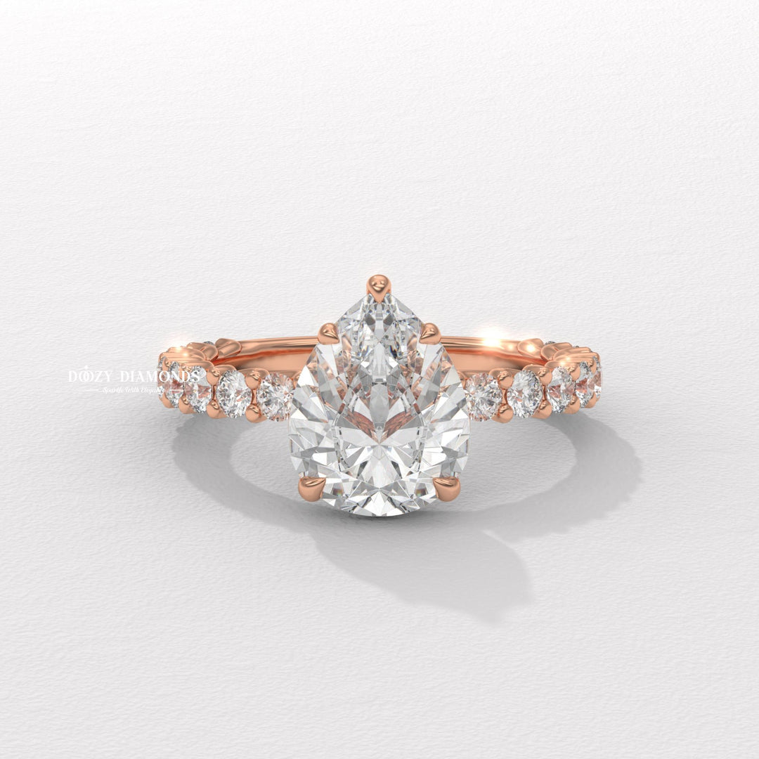 Close-up of pear cut center diamond in solitaire engagement ring