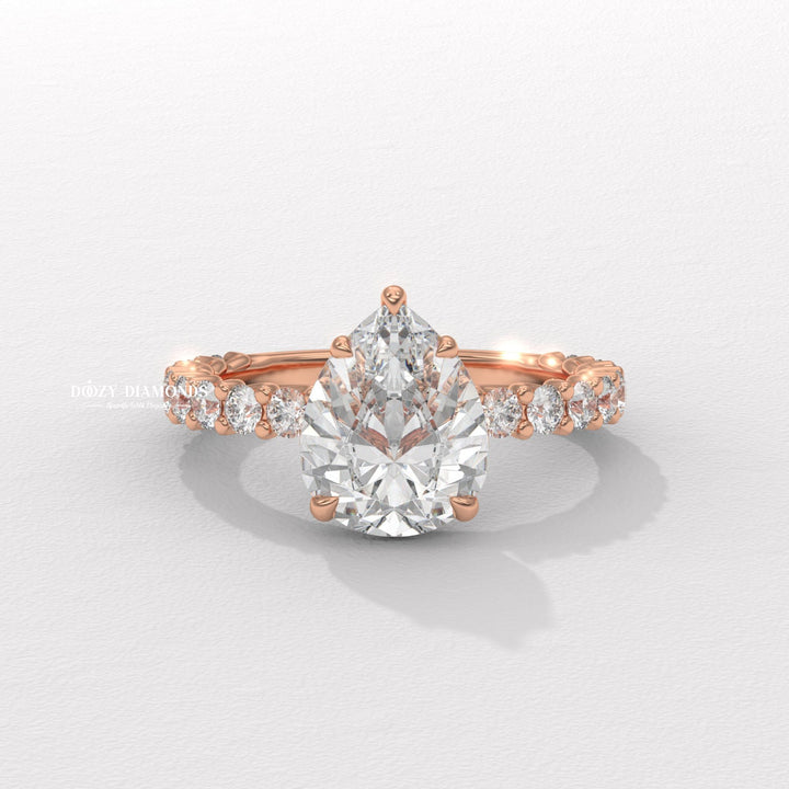 Close-up of pear cut center diamond in solitaire engagement ring