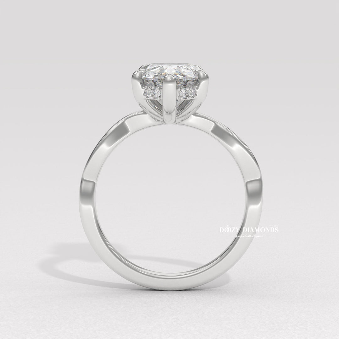 Pear cut solitaire engagement ring shown in real-life wear