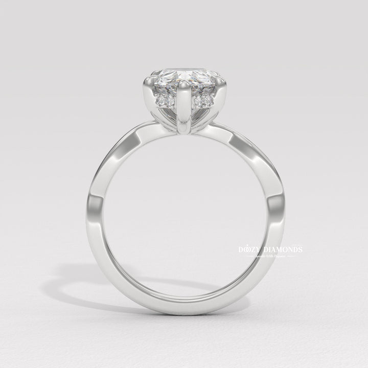 Pear cut solitaire engagement ring shown in real-life wear