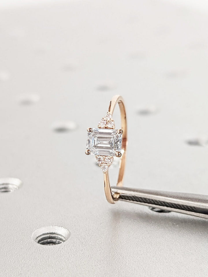 Emerald cluster diamond ring presented in signature gift packaging