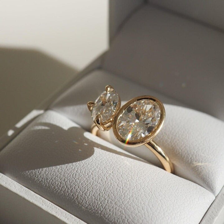 Oval bezel lab grown diamond ring fitted on finger