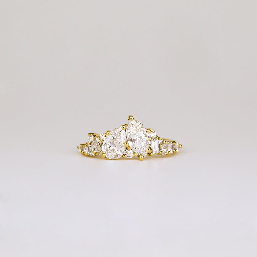 1.0CT pear cut cluster engagement ring available to buy now