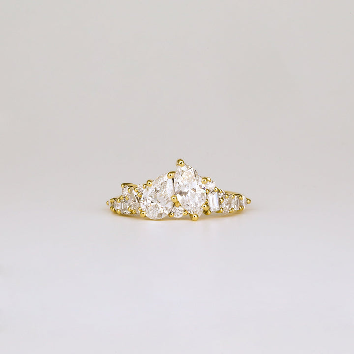 1.0CT pear cut cluster engagement ring available to buy now