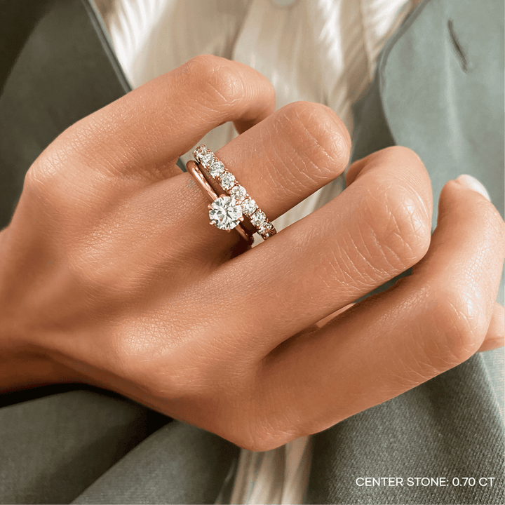 Detailed close-up of round solitaire diamond engagement ring