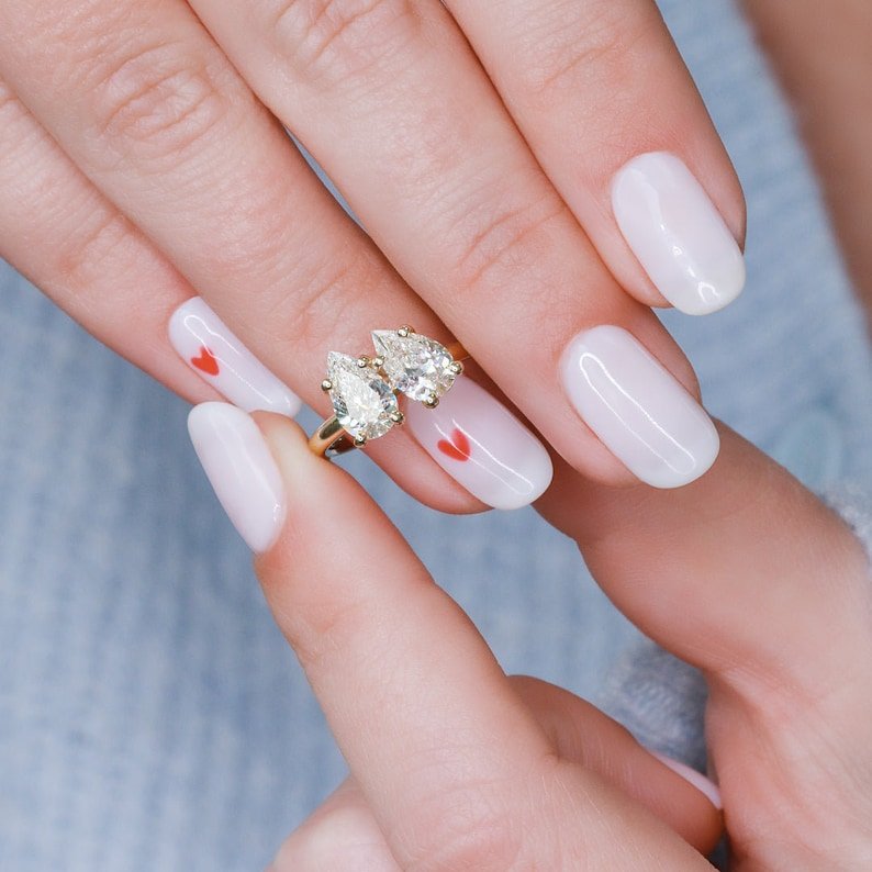 Pear cut diamond ring worn on hand