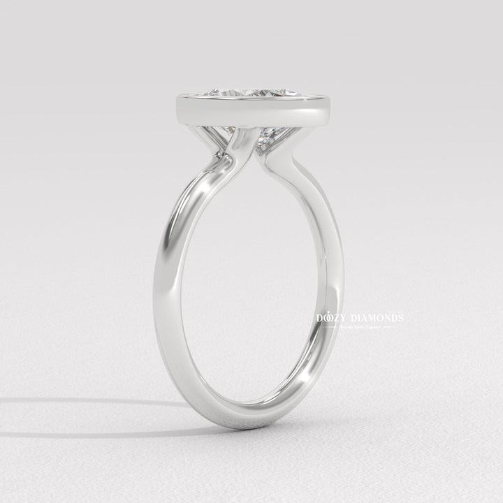 Handcrafted oval cut bezel lab grown diamond engagement ring