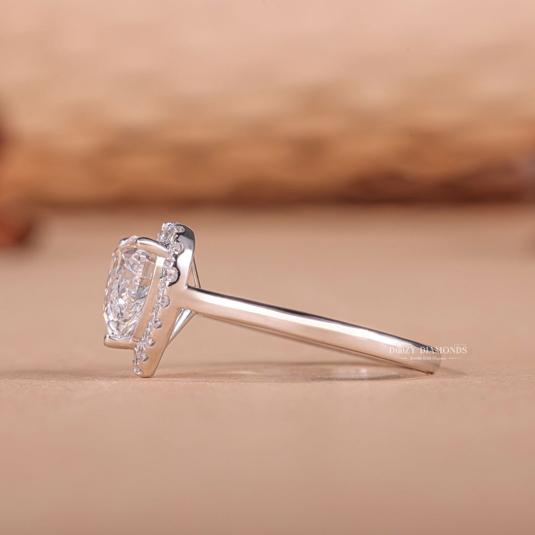Heart cut halo engagement ring shown in real-life wear