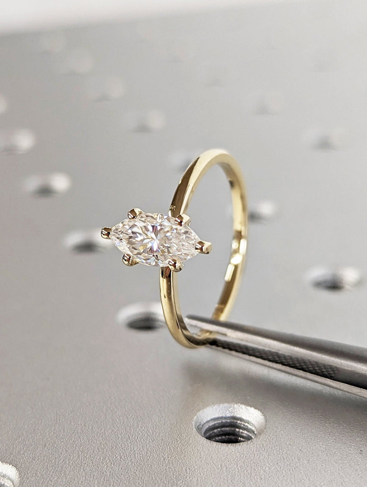 Marquise cut solitaire engagement ring shown in real-life wear